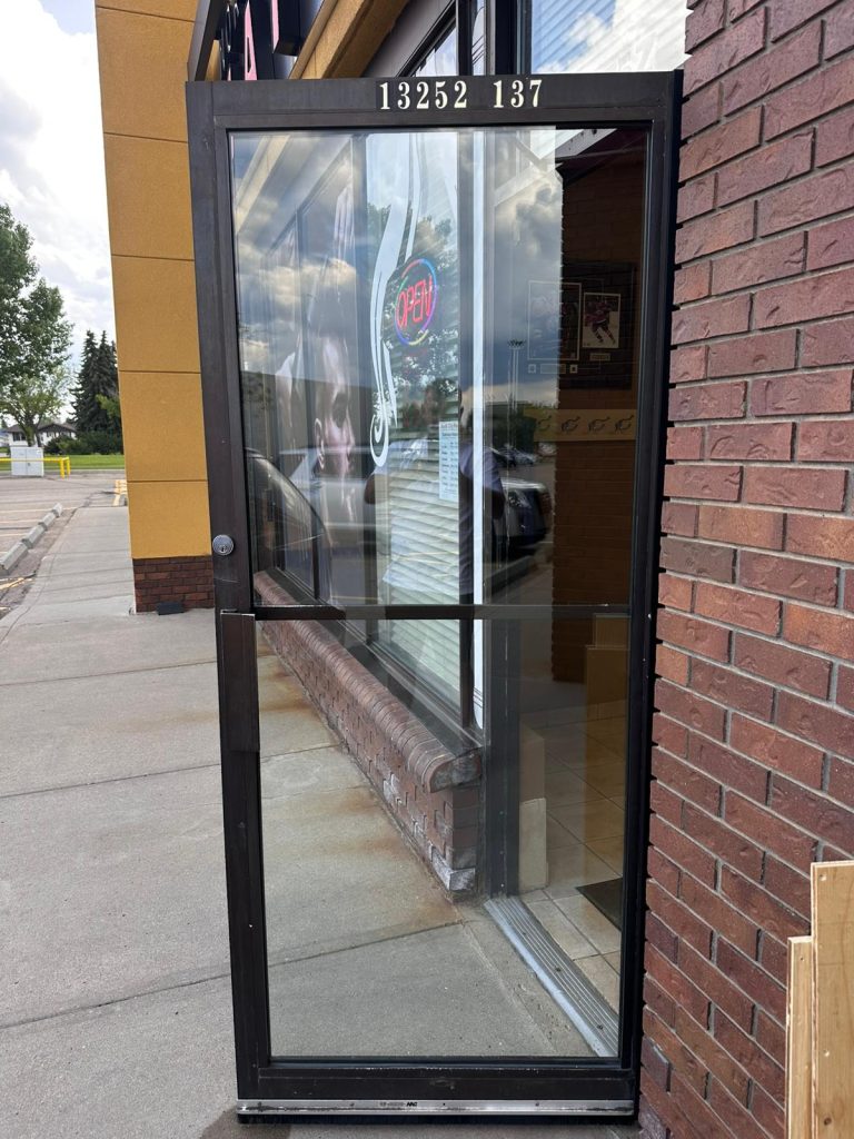 Storefront glass door by Max Windows & Doors
