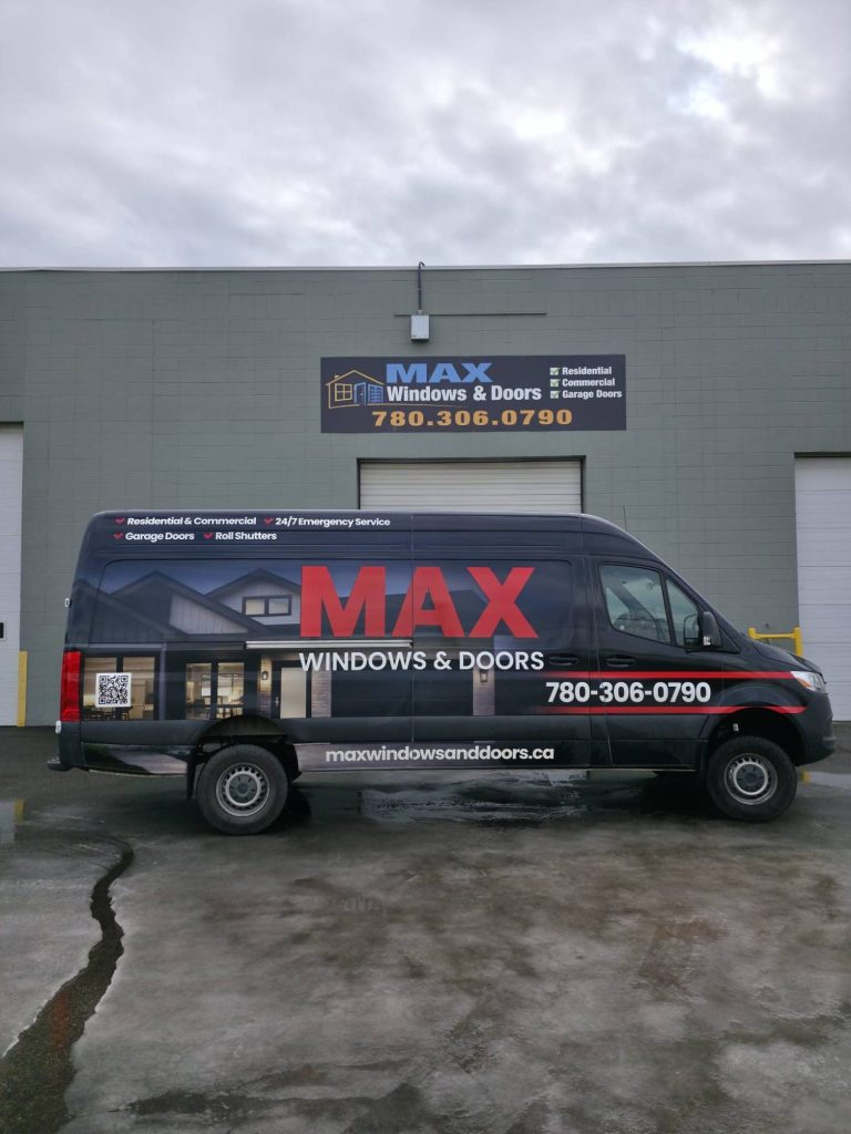 Max Windows & Doors service van in front of the shop sign