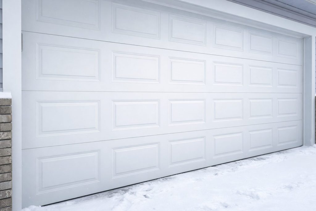 Max technician repairing a garage door
